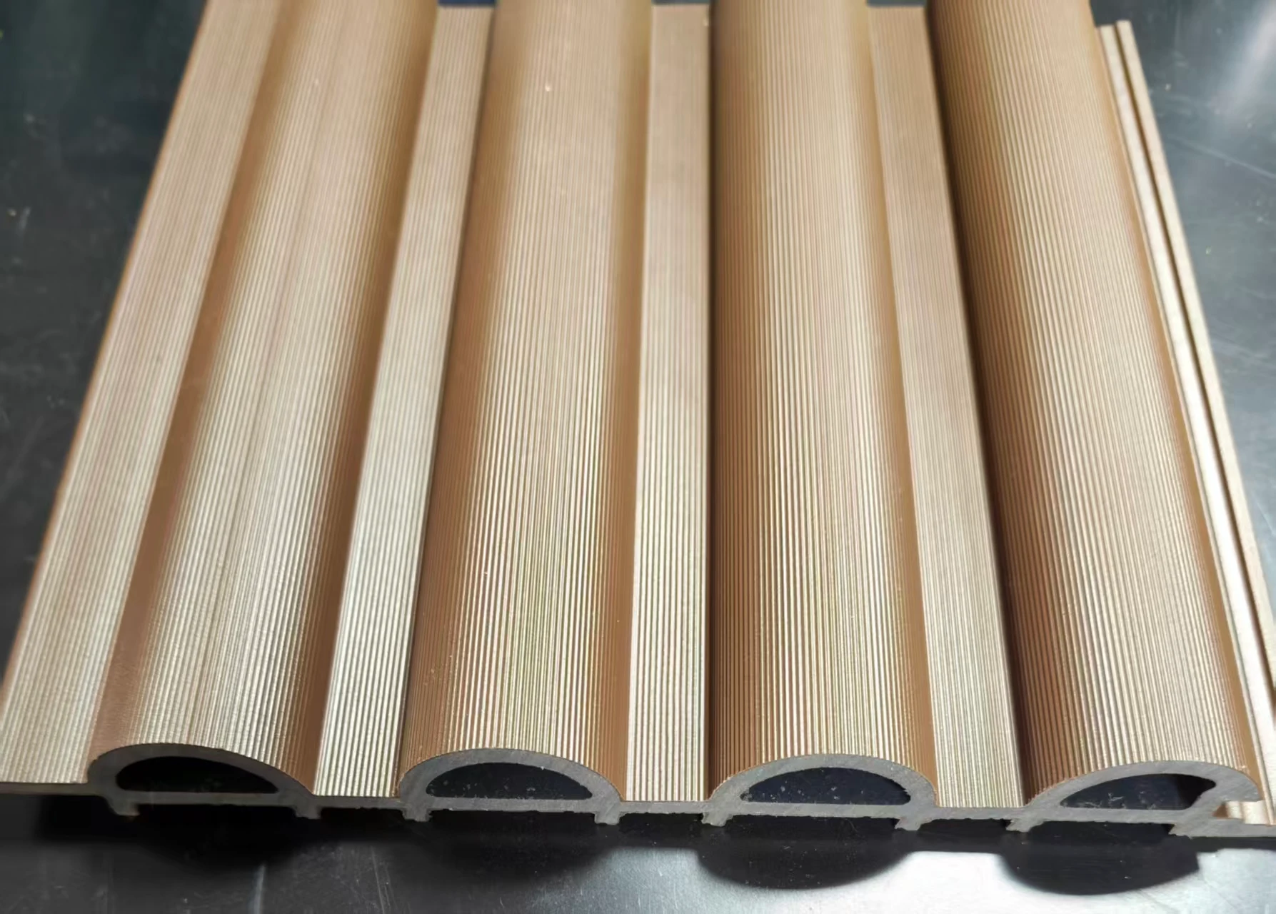 Actual cladding sample showing its surface and cross-section