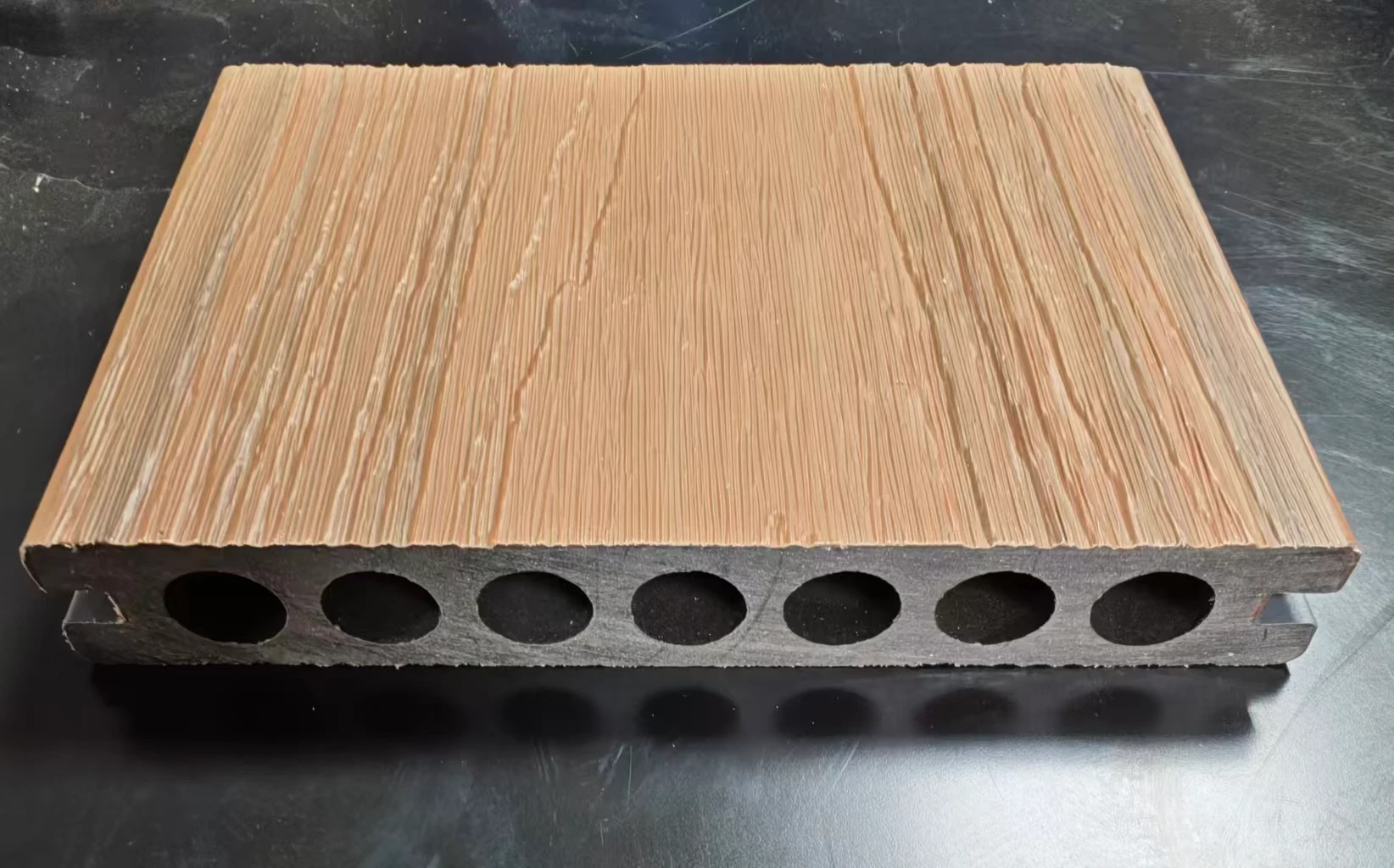 Actual decking sample showing its surface and cross-section